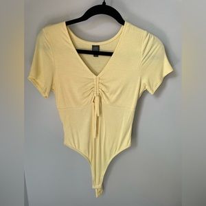 Pale yellow ribbed body suit - medium